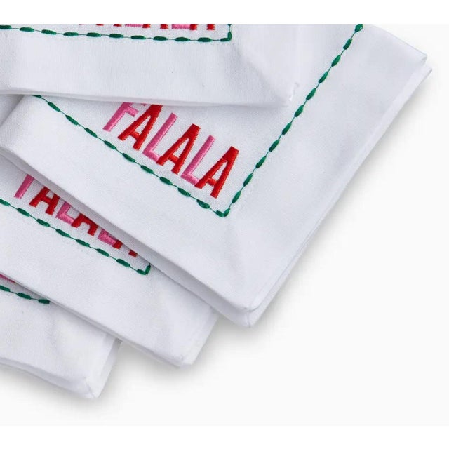 Add a festive touch to your holiday entertaining with the Falala Cocktail Napkin Set Of 4. These charming napkins feature...