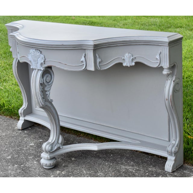 Antique (1920's) Console Table has a Hollywood Regency Style. Painted Gray Slightly Distressed. The Wood is Walnut. Carved...