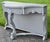 Antique (1920's) Console Table has a Hollywood Regency Style. Painted Gray Slightly Distressed. The Wood is Walnut. Carved...
