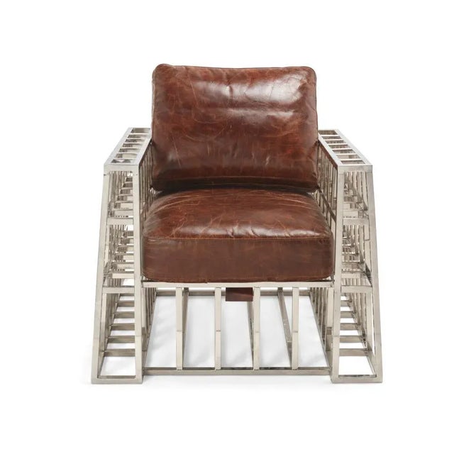 Andrew Martin brown Cage Club chair -Brown Leather & Crome Metal Dimensions : 33" H x 34" W x 33.5" D A beautiful piece...