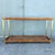 A fabulous vintage Palm Beach Chic console table combining warm rattan, woven cane, glass, and gold-tone accents. The...