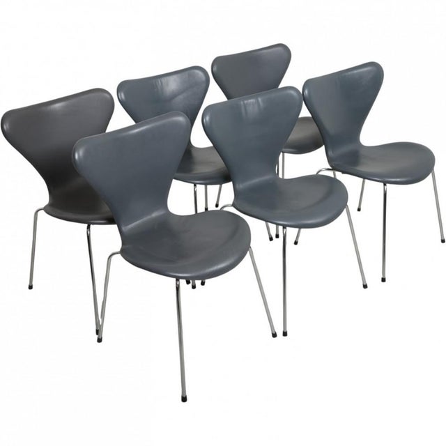 Set of 6 Arne Jacobsen Seven chairs upholstered in grey semi anilin leather and with chrome legs. The chairs are from 1986...