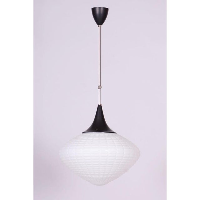 This stylish and highly elegant chandelier, originating from the 1960s from Czechoslovak production, represents an...