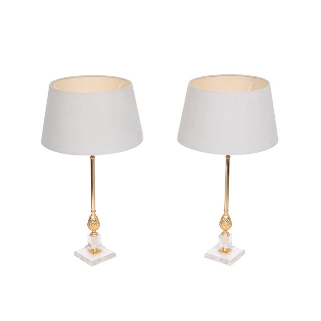 Very nice pair of elegant Table lamps . Brass Pineapples on a Lucite base . Hollywood Regency in style . Good quality...
