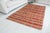This is a vintage Turkish Oushak rug from the Mid 20th Century. The piece was hand-knotted.