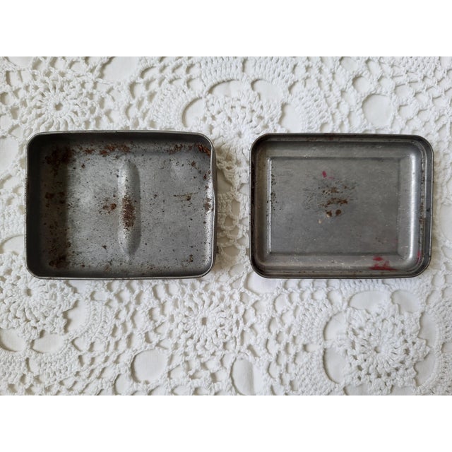 A metal nautical Packers Tar Soap tin from Mystic, Connecticut. Full of coastal charm and measuring 3 ½” l x 2 ¾” w x 1”...