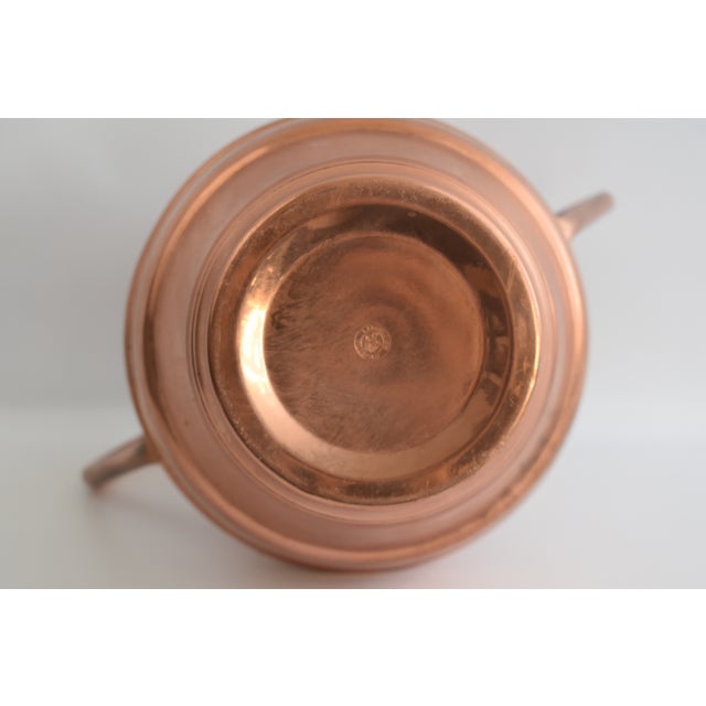 Copper vase with copper handles from the village of "Villedieu les poelles" in Normandie France. This small village on the...