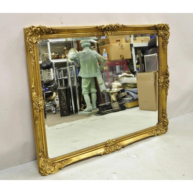 Vintage Friedman Brothers Gold French Rococo Style 45" Rectangular Wall Mirror. Item features beveled glass, ornate gesso...