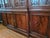 This beautiful breakfront bookcase cabinet features mahogany inlay and elegant brass pulls. The top consists of a four...