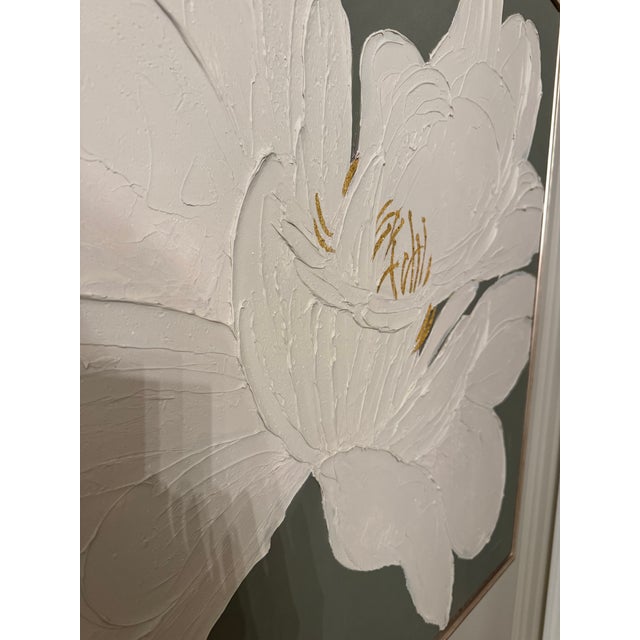 Green Top of the Morning” by Man Yee is a striking original floral painting with a sculptural white bloom set against a...