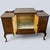 An elegant Art Deco walnut cocktail cabinet that bridges the clean geometry of the 1930s with graceful Queen Anne-inspired...