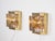 A pair of brutalist brass Maritim wall lamps. Their raw, sculptural form and geometric construction evoke the design of...