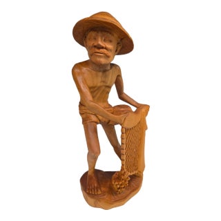 Mid-Century Balinese Art Deco Seated Fisherman With Cast Net Sculpture For Sale