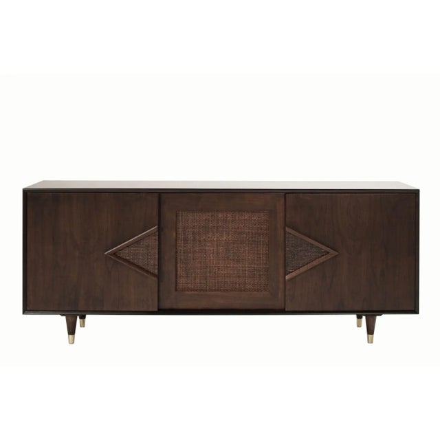 A very handsome credenza or sideboard executed in dark walnut, completely restored, circa 1950-1950. It features three...