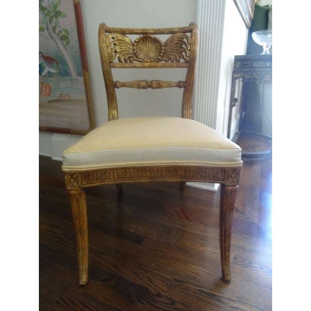 A fabulous Regency Giltwood chair that is a extremely close copy of the shellback chair by Rose Tarlow. Perfect for a...