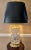 Waterford's "Overture" table lamp in cut crystal and brass. The ovoid crystal body is deeply cut with swags. The brass...