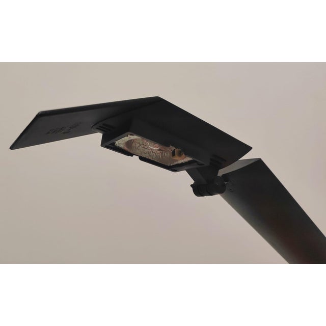 A beautiful large black Condor desk lamp, designed by Hans von Klier and produced by Bilumen in 1988. This piece is...