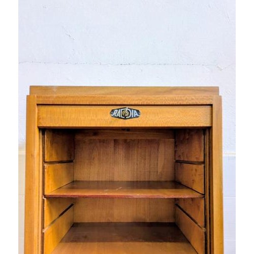 High-end filing cabinet with a rolling shutter, made by radia. Fully restored and relined, in light oak, complete with all...