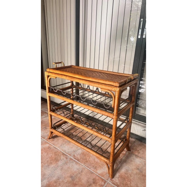 A beautifully crafted 1990s bar cart by Maitland-Smith, showcasing the brand’s signature blend of natural materials and...