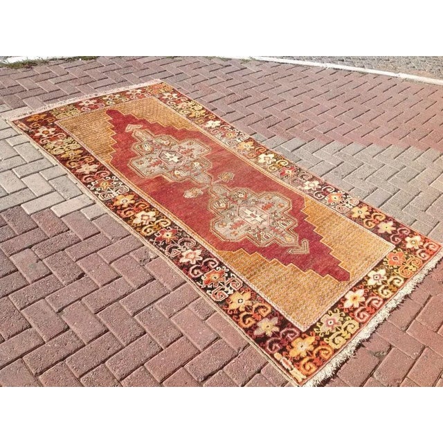 This gorgeous hand knotted Vintage Anatolian rug is approximately 60 years old in excellent vintage condition. The rug is...