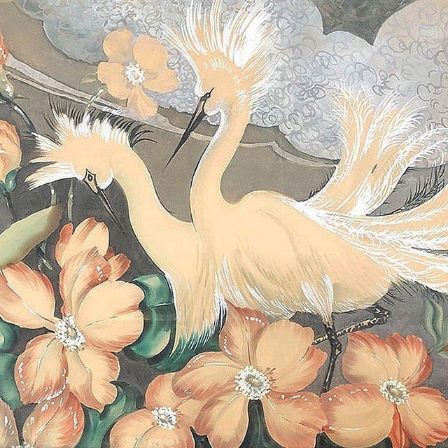 Post-war framed print featuring 2 cranes/egrets in a tropical Hawaiian floral scenic landscape originally done in...
