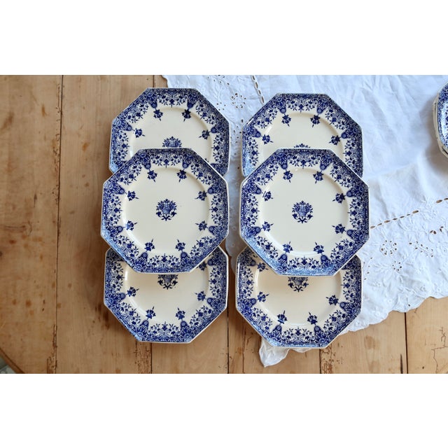 Exquisite set of six Longchamp ironstone dessert plates, Rouen pattern, dating from the late 19th century. Their deep blue...