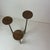 Sculptural Brutalist floor candle holder crafted in solid cast bronze, featuring three elongated organic branches that...