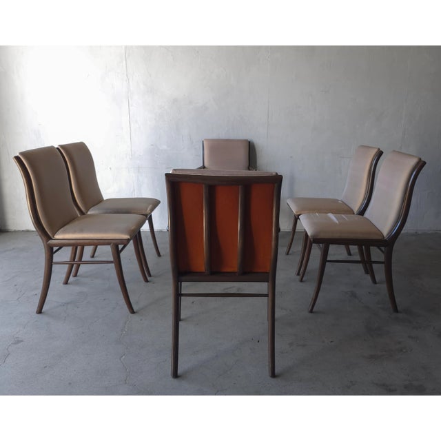 Rare and Iconic set of 6 Mid Century Sabre Leg Dining Chairs by T.H. Robsjohn Gibbings for Widdicomb. There are 2 arm...