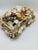 This is a vintage shell-encrusted jewelry box, a truly ornate and whimsical treasure chest that celebrates the bounty and...