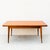 A rare and impressive modernist draw leaf dining table attributed to Gaston Poisson, made in France c. 1950s. The dining...