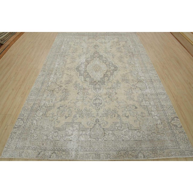 An authentic vintage traditional Tabriz rug hand-knotted with an all-wool pile on a cotton foundation. This oriental rug...
