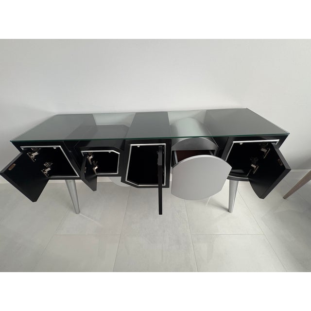 60" W x 16" D x 33 1/2" H console table. Can be used anywhere. Has drawers for small storage. Glass top. Modern, stylish,...