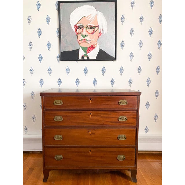 With graceful French bracket feet, beautifully figured mahogany, and subtle inlay along the base and around the keyholes,...