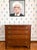 With graceful French bracket feet, beautifully figured mahogany, and subtle inlay along the base and around the keyholes,...