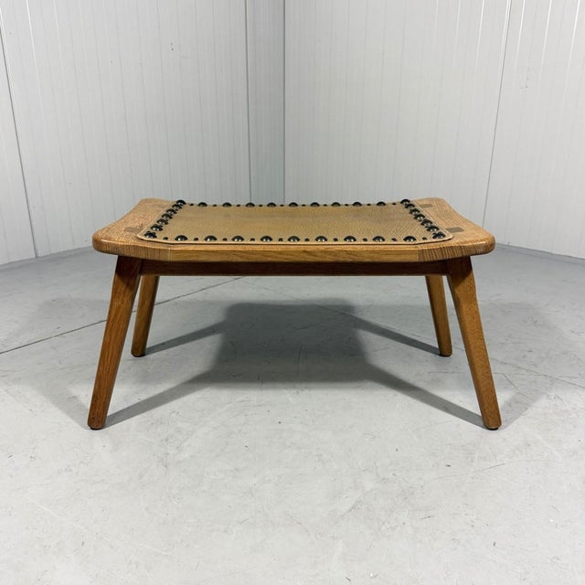 Beautiful shaped stool, small bench in blonde oak with a vinyl seat and eye-catching decorative upholstery tacks. In the...