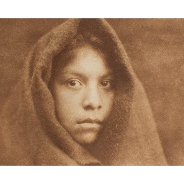 A photogravure restrike after a photograph by American photographer Edward Curtis (1868-1952). Titled "A Makah Maiden,"...
