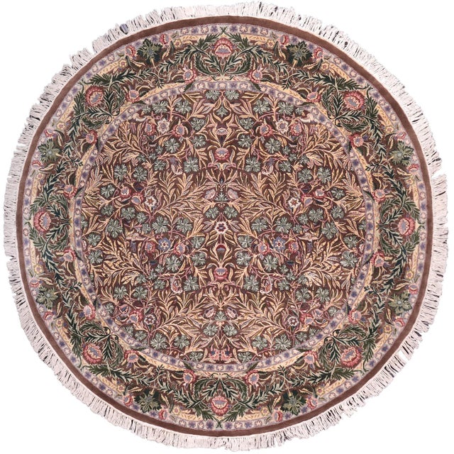 This hand‑knotted Pak Persian round rug showcases the finest expression of traditional Persian artistry. Each piece is...