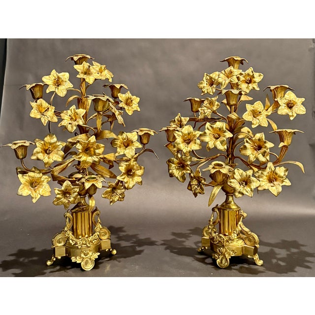 A fine pair of antique French Napoleon III gilt bronze seven-light candelabra, exquisitely cast in the form of abundant...