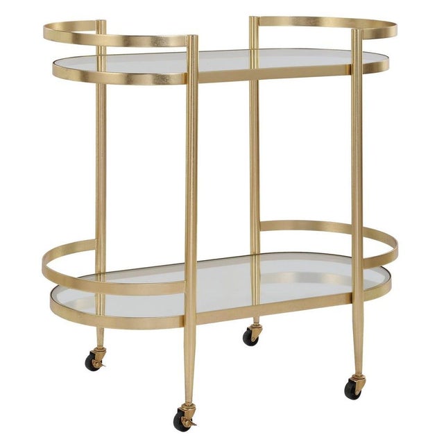 A refined Glam serving cart, forged with a beautiful soft gold brushed finish made completely from iron. The rounded...