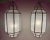This elegant pair of Art Deco-inspired chandeliers or pendants exudes timeless sophistication and architectural harmony....