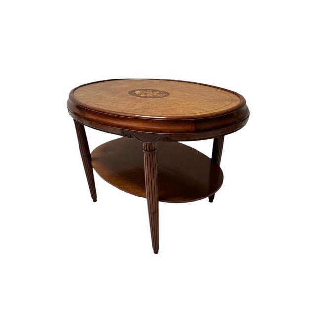 Stunning and elegant Art Deco center table. Striking French design from the 1930s. Solid walnut frame with original...