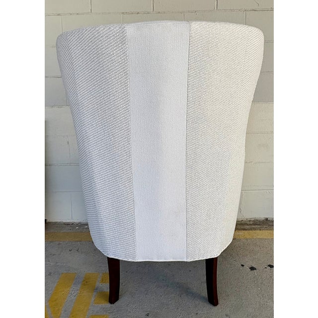 Original retail $2730, stylish Modern White Surfside Wingback Chair, dark wood legs, showroom floor sample