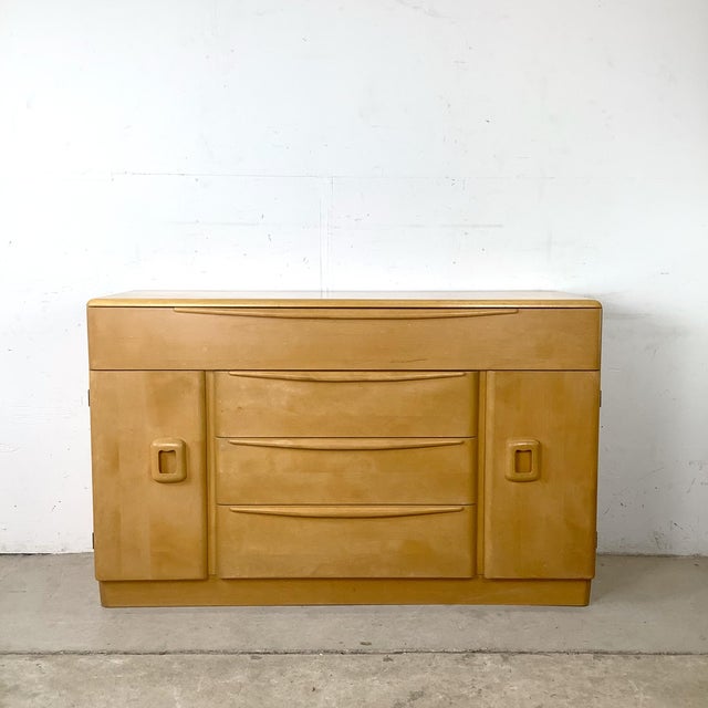 An enduring example of American Mid-Century Modern design, this vintage Heywood-Wakefield buffet from the sought-after...