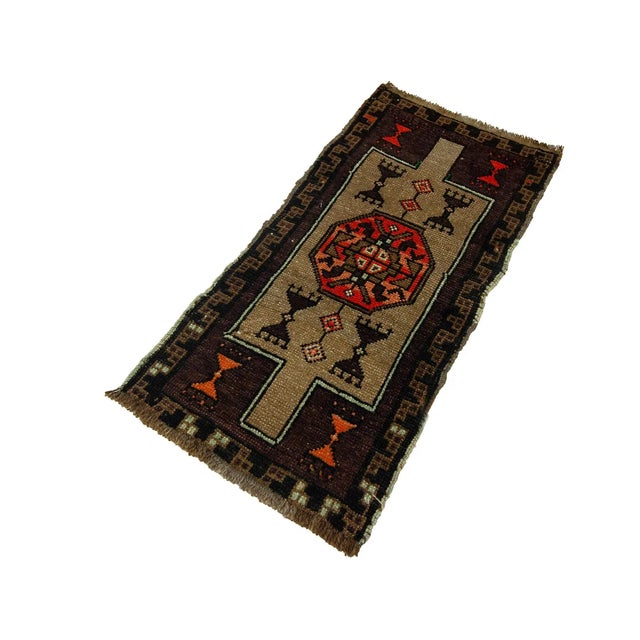 Vintage Handknotted decorative mini rug from Kars region of Turkey. Approximately 45-55 years old. In very good condition.