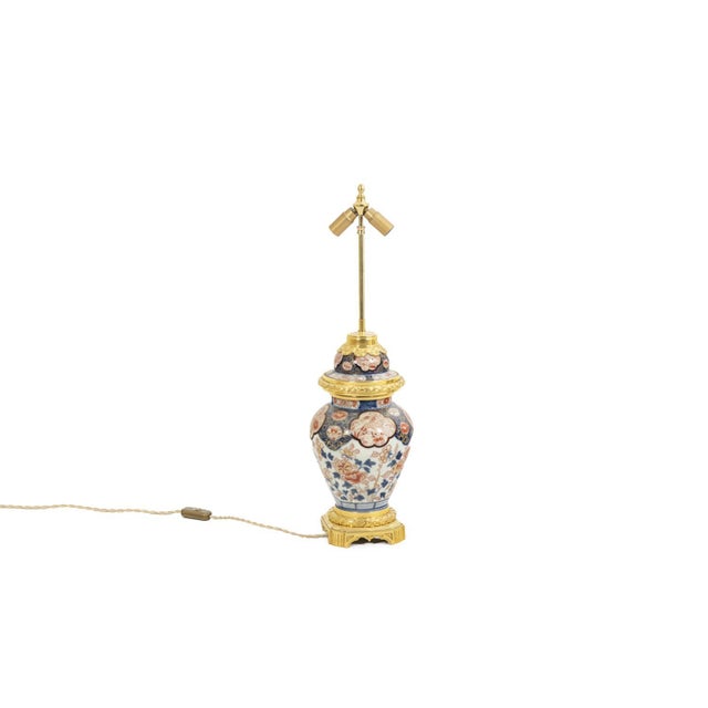 Lamp in Imari porcelain and gilded bronze. Quadripot and rudented frame. Work carried out circa 1880. This piece is...