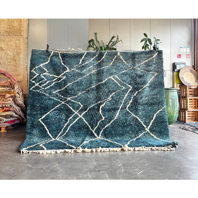 This luxurious Moroccan Beni M’rirt rug is a contemporary handmade piece crafted by skilled Berber artisans in the Middle...
