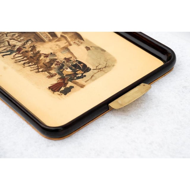 Lithographed tray, made in italy, 1950s. This is a vintage 1950s lithographed wooden tray with brass handles. There is a...