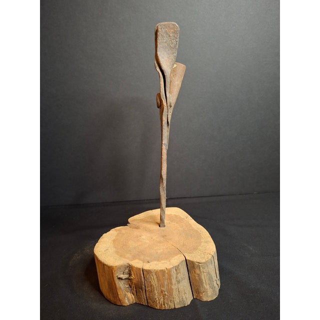 Up for sale is a bench-forged wrought iron combination rushlight holder and candle socket mounted on a heavy slab wood...