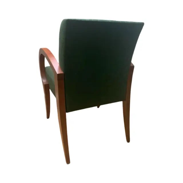 This is the Kensington chair Attributed to Brueton. It is upholstered in a darker green with a pattern and has red brown...