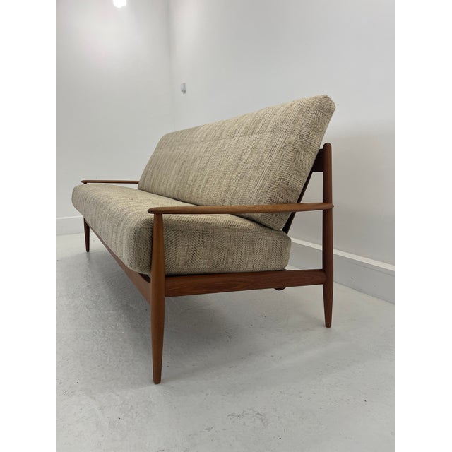 The sofa is in its original condition, the original upholstery is in very good condition. This piece has an attribution...